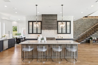 Reintroducing this 2021 custom built home with a newly - photo 10
