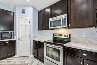 This delightful 3-bedroom, 2-bathroom home offers a warm and - photo 8