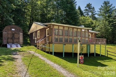 Escape to the mountains in this custom log cabin located in the - photo 15