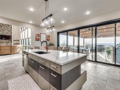 PANORAMIC LAKE VIEWS + TRUE LAKE LIFE LIVING! Discover elevated - photo 17