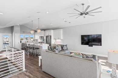 Beach access directly across the street sets the tone for this