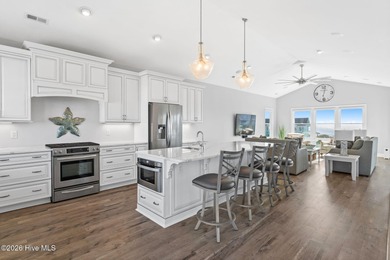 Beach access directly across the street sets the tone for this