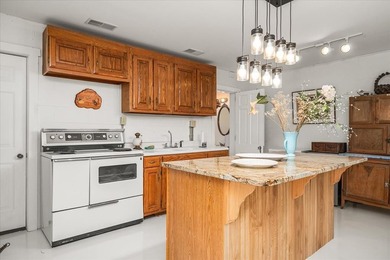 *Down by the lazy river* happily describes this riverside home - photo 33