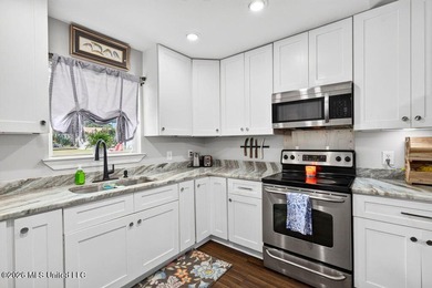 Welcome home to this inviting 4-bedroom, 2-bath home situated on - photo 13