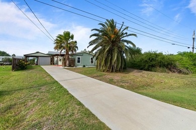Don't miss this canal-front, Texas gem in Copano Cove. Framed by - photo 2