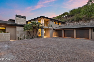 Perched high in the prestigious Tatum Canyon, this modern