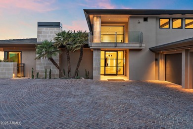 Perched high in the prestigious Tatum Canyon, this modern
