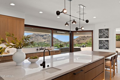 Perched high in the prestigious Tatum Canyon, this modern