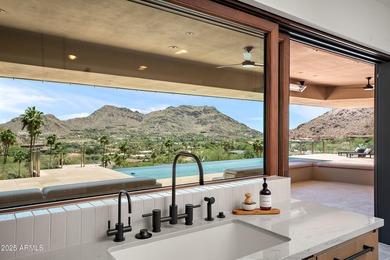 Perched high in the prestigious Tatum Canyon, this modern