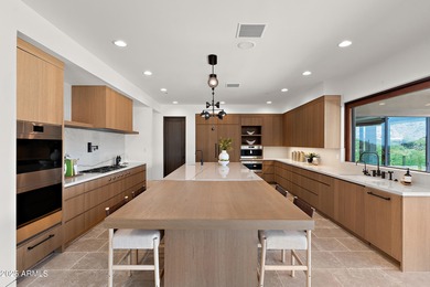 Perched high in the prestigious Tatum Canyon, this modern