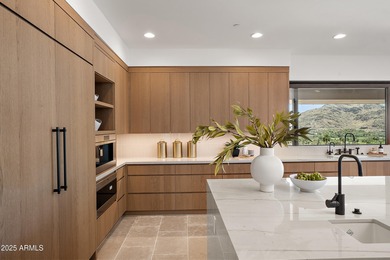 Perched high in the prestigious Tatum Canyon, this modern