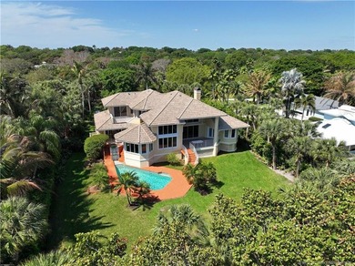 Framed by swaying palms and endless water views, this estate - photo 2