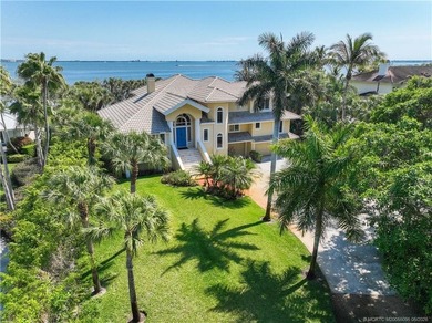 Framed by swaying palms and endless water views, this estate - photo 3