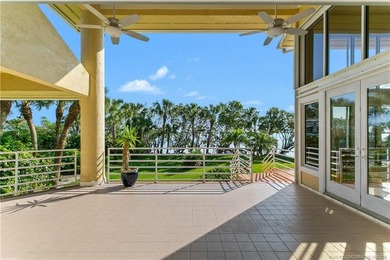 Framed by swaying palms and endless water views, this estate - photo 7