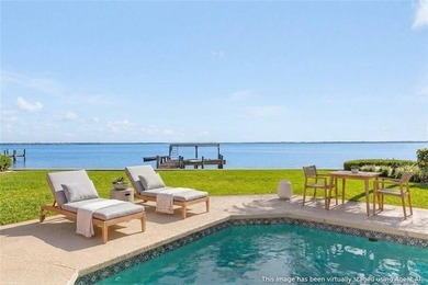 Framed by swaying palms and endless water views, this estate - photo 10