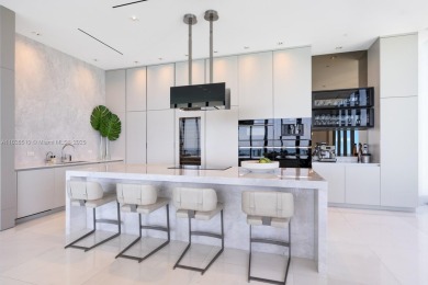 Experience oceanfront luxury living at its finest in this