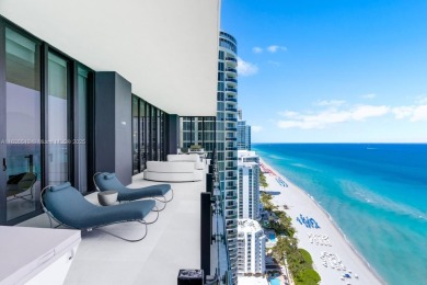 Experience oceanfront luxury living at its finest in this