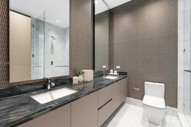 Experience oceanfront luxury living at its finest in this