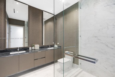 Experience oceanfront luxury living at its finest in this