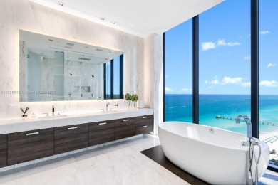 Experience oceanfront luxury living at its finest in this