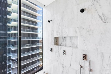 Experience oceanfront luxury living at its finest in this