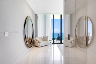 Experience oceanfront luxury living at its finest in this