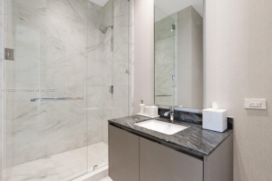 Experience oceanfront luxury living at its finest in this