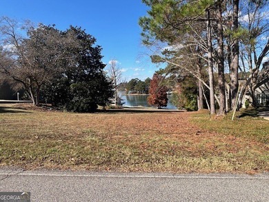 Almost 1 DEEDED acre with approximately 94' WATER FRONTAGE on - photo 2