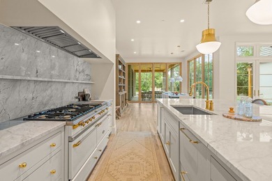 Nestled on a sprawling one-acre lot within the prestigious gated - photo 11
