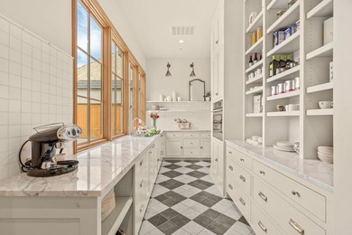 Nestled on a sprawling one-acre lot within the prestigious gated - photo 13