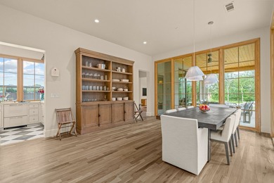 Nestled on a sprawling one-acre lot within the prestigious gated - photo 15