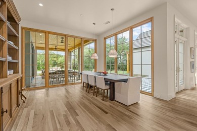 Nestled on a sprawling one-acre lot within the prestigious gated - photo 16