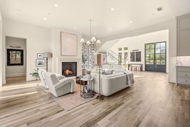 Nestled on a sprawling one-acre lot within the prestigious gated - photo 18