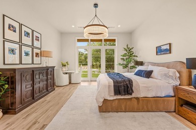 Nestled on a sprawling one-acre lot within the prestigious gated - photo 20