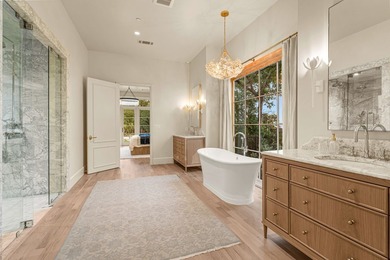 Nestled on a sprawling one-acre lot within the prestigious gated - photo 22