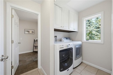 Tucked away on a quiet cul-de-sac, this exceptional waterfront - photo 24