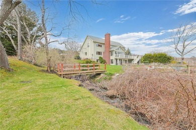 Tucked away on a quiet cul-de-sac, this exceptional waterfront - photo 26