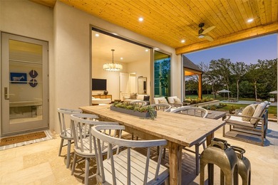 Nestled on a sprawling one-acre lot within the prestigious gated - photo 34