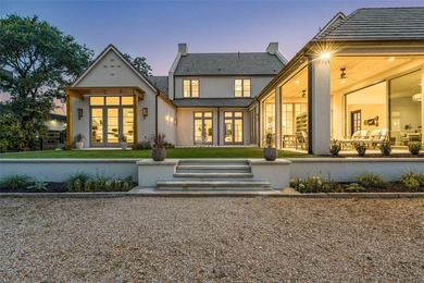 Nestled on a sprawling one-acre lot within the prestigious gated - photo 36