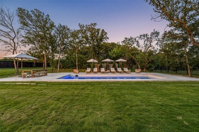 Nestled on a sprawling one-acre lot within the prestigious gated - photo 38