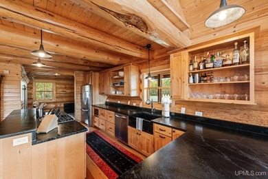 Escape to your own private paradise in this stunning log home - photo 11