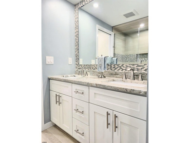 Experience coastal living at its finest in magnificently updated