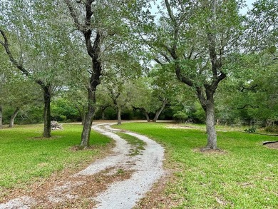 Tucked away on 2 private, oak-studded acres, this peaceful - photo 4