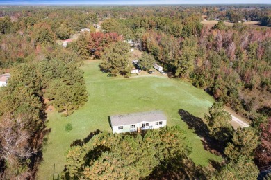 Lake Home Off Market in Holly Hill, South Carolina