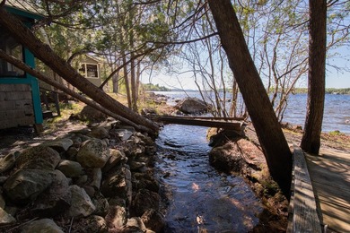 Tucked away on coveted Sebec Lake, this rustic camp feels like - photo 3
