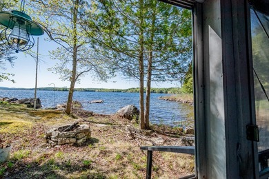 Tucked away on coveted Sebec Lake, this rustic camp feels like - photo 4