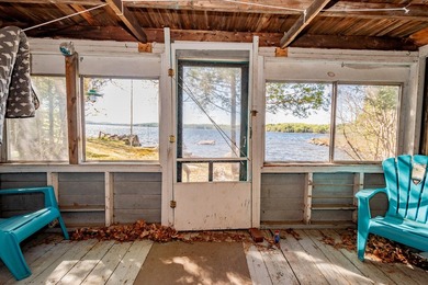 Tucked away on coveted Sebec Lake, this rustic camp feels like - photo 5