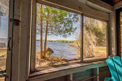 Tucked away on coveted Sebec Lake, this rustic camp feels like - photo 6