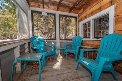 Tucked away on coveted Sebec Lake, this rustic camp feels like - photo 8