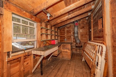 Tucked away on coveted Sebec Lake, this rustic camp feels like - photo 10